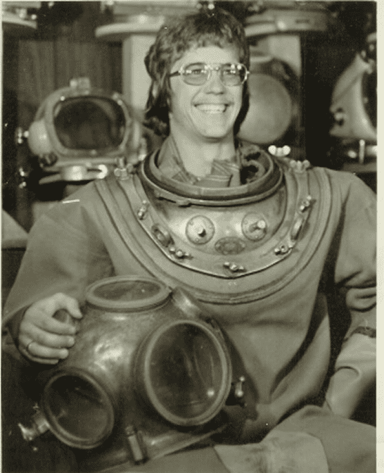 Smiling man in vintage diving suit.