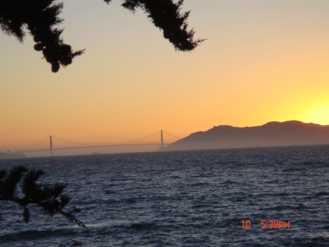 Sunset over bridge and ocean view.