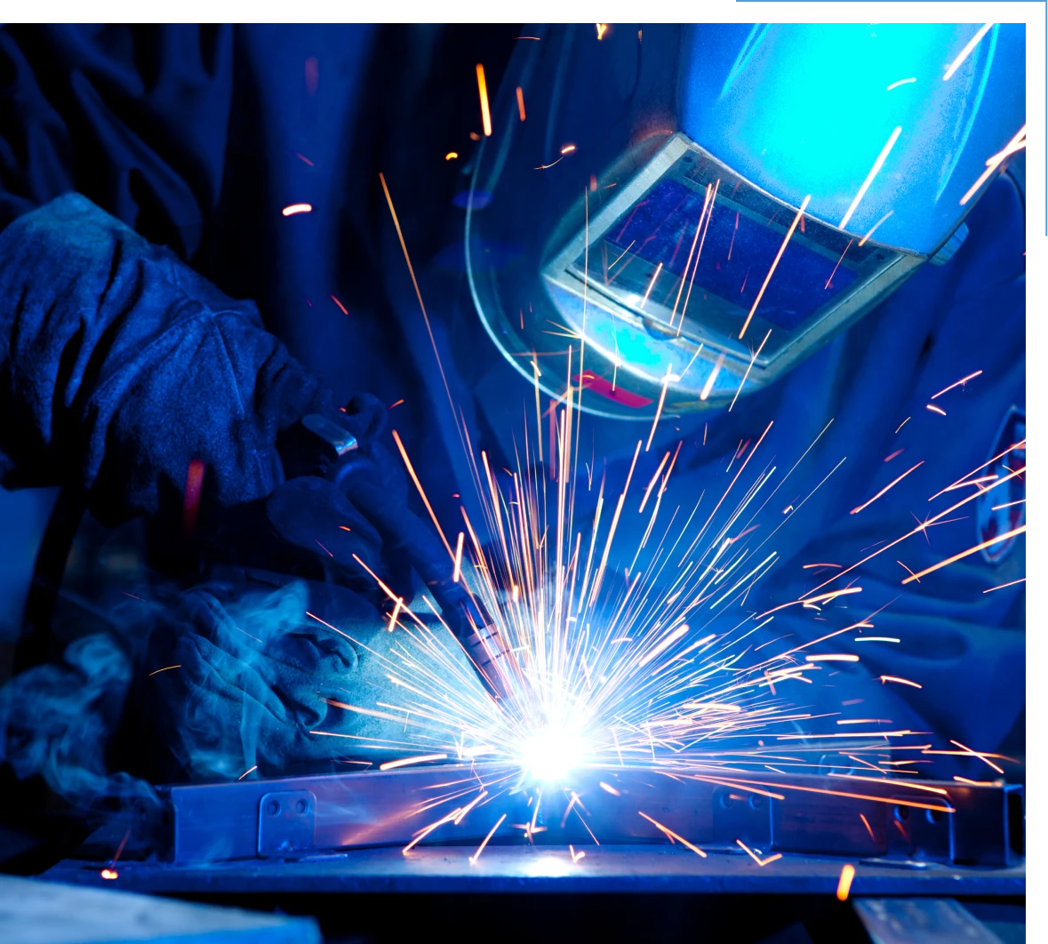 Welder at work with bright sparks.