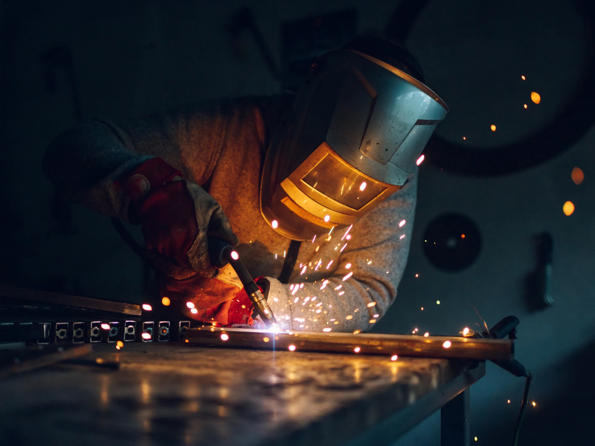 Welder working with sparks flying.